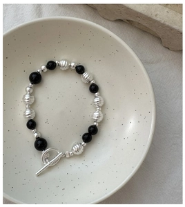 Detail of S925 silver beaded bracelet with black onyx and vintage OT toggle clasp