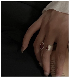 Detail of S925 silver ring with red agate stones and vintage brushed metal finish