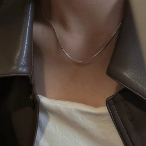 Minimalist S925 sterling silver flat snake bone chain necklace worn on the collarbone