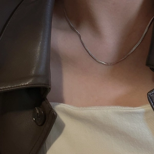Minimalist S925 sterling silver flat snake chain necklace worn on the collarbone