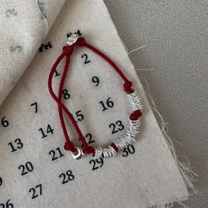 Handcrafted red string bracelet with S925 sterling silver rings and adjustable clasp