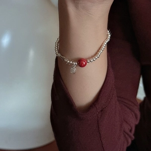 S925 sterling silver beaded bracelet featuring a red cinnabar bead and a fortune charm