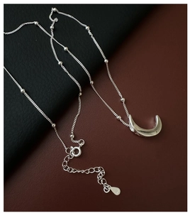 Detailed view of S925 sterling silver moon pendant with lobster clasp and hallmark