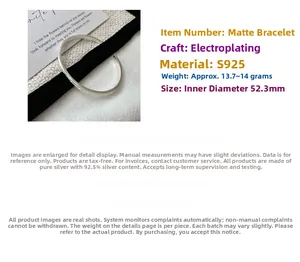 Close-up of matte S925 sterling silver open bangle with irregular frosted texture