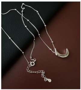 Close-up of S925 sterling silver stamp on the moon pendant chain with lobster clasp