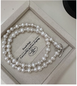 Detail of S925 sterling silver pearl necklace with vintage OT toggle clasp on display