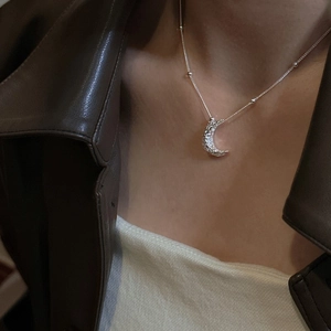 S925 sterling silver moon pendant necklace with textured finish on a minimalist bead chain