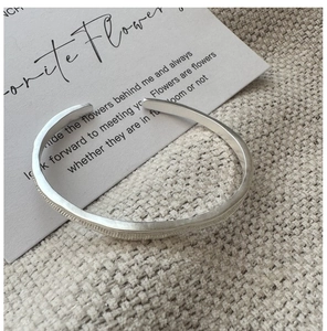 Close-up of S925 sterling silver open bracelet featuring retro hammered texture finish