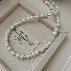 S925 sterling silver pearl OT buckle necklace with natural luster beads on display
