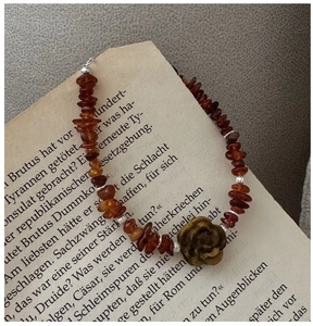 Macro shot of S925 sterling silver beaded bracelet with vintage rose flower pendant