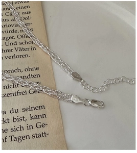 Close-up of S925 sterling silver woven lace chain with lobster clasp and hallmark