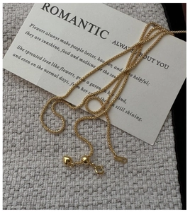 Detail view of gold adjustable S925 silver chain necklace with heart pendant