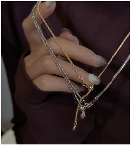 Close-up of S925 sterling silver woven chains with gold and tri-color textures