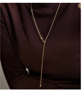 Adjustable S925 sterling silver Y-shaped necklace with sliding bead on dark knit