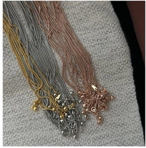 Detailed view of S925 sterling silver ball chains in gold, silver, and rose gold finishes