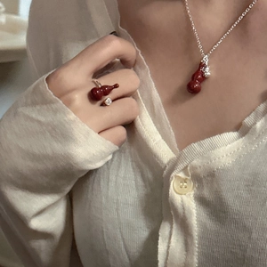 Vintage S925 silver necklace and ring set with dark red gourd pendants on a model