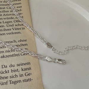 Elegant S925 sterling silver woven lace necklace featuring a shimmering glitter design