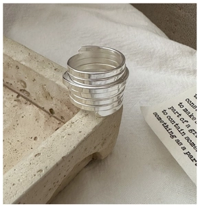 Macro detail of S925 sterling silver multi-layer spiral ring showing official hallmark