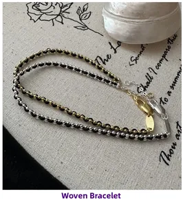 Detail of woven rope bracelets with gold and silver beads, featuring lobster claw clasps