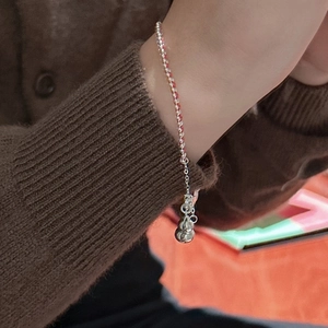 Minimalist S925 sterling silver red string bracelet with a polished gourd pendant on wrist