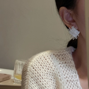 Minimalist S925 sterling silver woven square stud earrings shown on model
