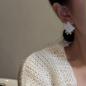 Minimalist S925 sterling silver woven square earrings shown on a model in a close-up view