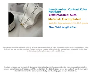 Detail of S925 sterling silver two-tone link chain necklace with polished finish