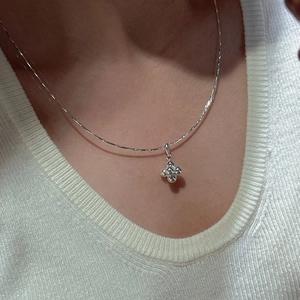 Elegant S925 sterling silver necklace featuring a sparkling clover pendant on a slim chain