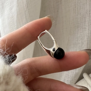 Minimalist S925 sterling silver hoop earrings featuring a polished black agate bead drop