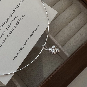 S925 sterling silver ball clover necklace displayed in a premium wooden jewelry box