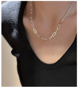 Close-up of S925 silver necklace with two-tone gold and silver interlocking chains