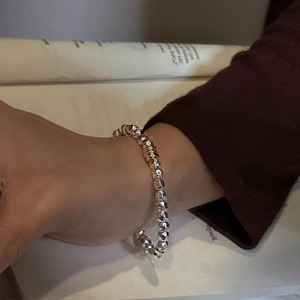 Minimalist S925 sterling silver beaded bracelet with faceted stones worn on model wrist
