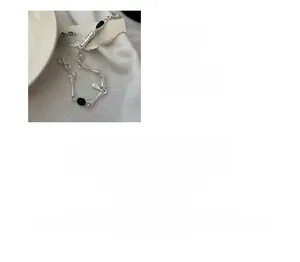 Detailed view of S925 sterling silver matte bracelet featuring oval black agate stones