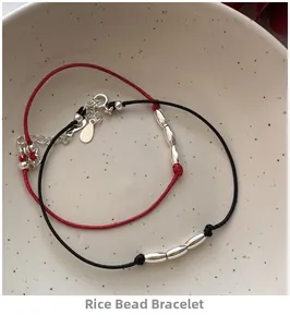 Close-up of S925 silver rice beads on woven red and black adjustable cord bracelets