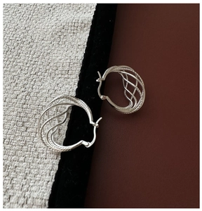 Close-up of S925 sterling silver triple hoops with mesh texture and hallmark stamp