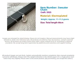 Close-up of polished S925 sterling silver heart pendant on a 66cm sweater chain