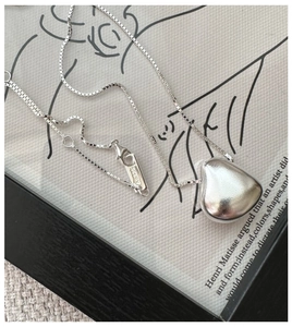 Macro view of S925 sterling silver heart pendant necklace with AG925 hallmark