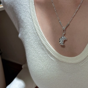 Minimalist S925 silver croissant pendant necklace shown worn on a model with a knit sweater