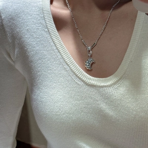 S925 sterling silver croissant pendant necklace on model with knit sweater background