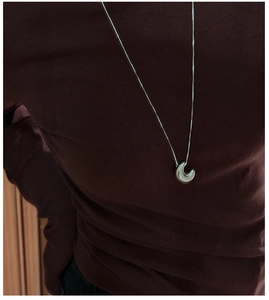 Polished S925 sterling silver hollow moon pendant necklace shown on a model