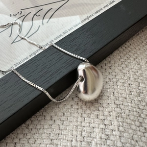 Minimalist S925 sterling silver necklace with organic bean pendant on elegant box chain