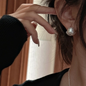 Elegant S925 sterling silver ball stud earrings with woven texture and minimalist design