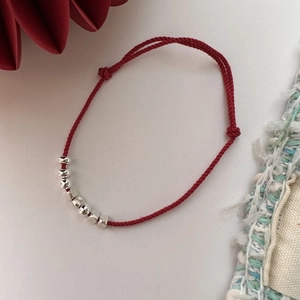 Handmade red cord bracelet with S925 silver beads, adjustable minimalist design for women