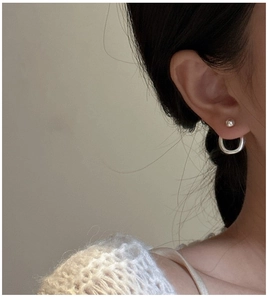 Detail view of S925 sterling silver minimalist double-layer round bead stud earrings for women