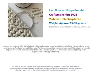 Detailed macro view of S925 silver dog and bone charms on elastic beaded bracelet