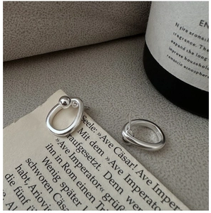 Detail of S925 sterling silver knotted stud earrings with bead and S925 hallmark stamp