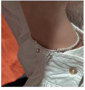 Macro detail of S925 sterling silver puppy bracelet with spiral texture on wrist
