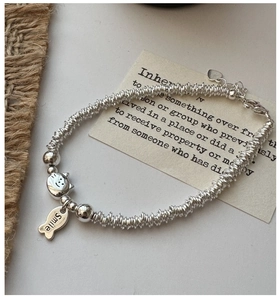 Detail of S925 sterling silver beaded bracelet with cat and Smile fish charm charms