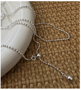 Detail of S925 sterling silver beaded necklace featuring a sliding ball clasp mechanism