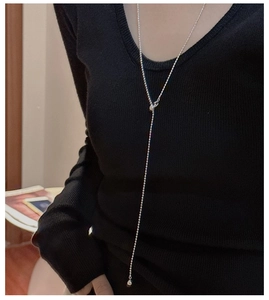 S925 silver Y-shaped pull chain necklace with square beads worn on a dark sweater